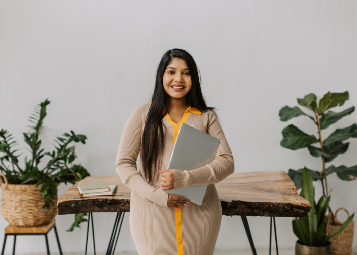 Smiling young woman with her internationally recognised accreditation