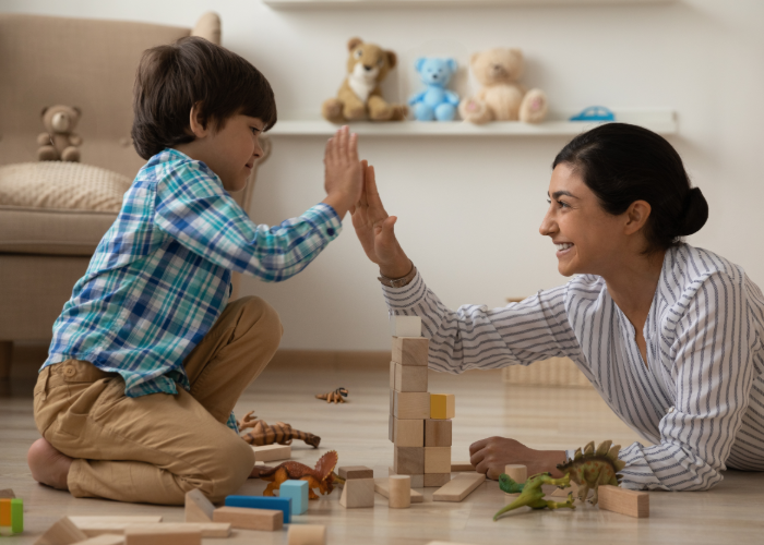 Woman and child playing on the floor